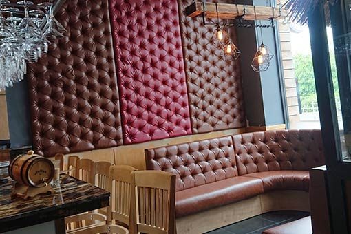 Mahoney’s steak house seating & upholstered wall panels